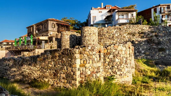 City landscape - Old fortress wall on the background of the city houses