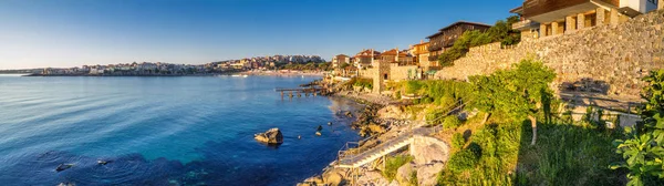 Coastal landscape banner, panorama - embankment with fortress wall in the city of Sozopol on the Black Sea coast in Bulgaria