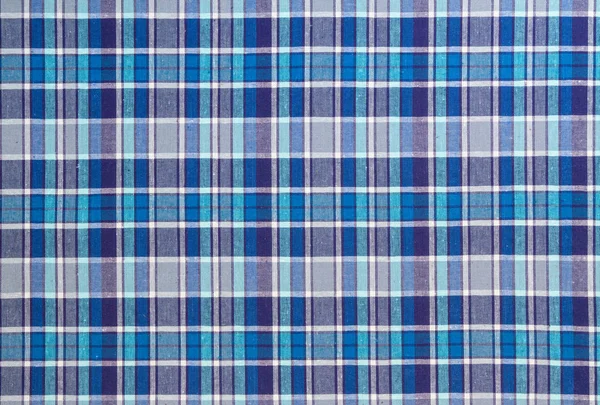 Flannel, cotton into the classic scottish cell as textile background in vintage style