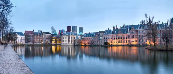 City Landscape, sunset panorama - view on pond Hofvijver and complex of buildings Binnenhof in from the city centre of The Hague, The Netherlands