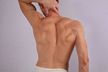 Male Waxing. Muscular male back, torso, chest and armpit hair removal.