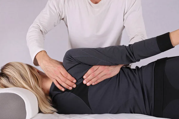 Woman having chiropractic back adjustment close up. Osteopathy, Alternative medicine, pain relief concept — Stock Photo, Image