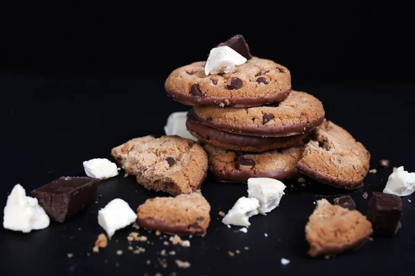 Double chocolate chip cookies on black background — Stock Photo, Image