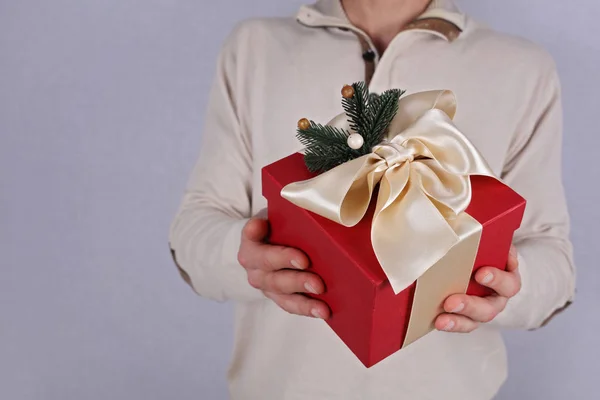 Man holding red present with white Ribbon close up. Gift box. , New year, Christmas concept. — Stock Photo, Image