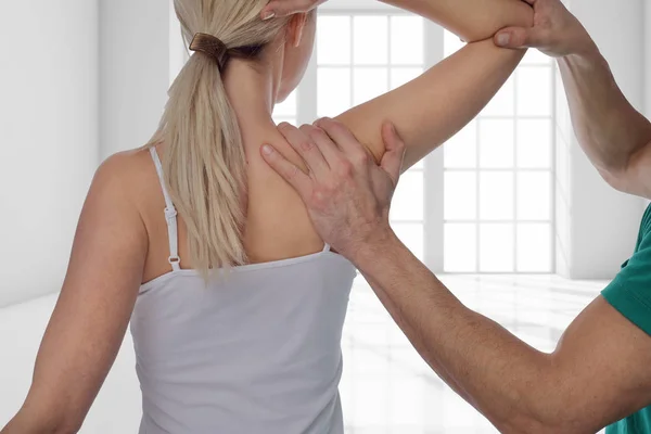 Woman having chiropractic back adjustment. Osteopathy, Alternative medicine, pain relief concept