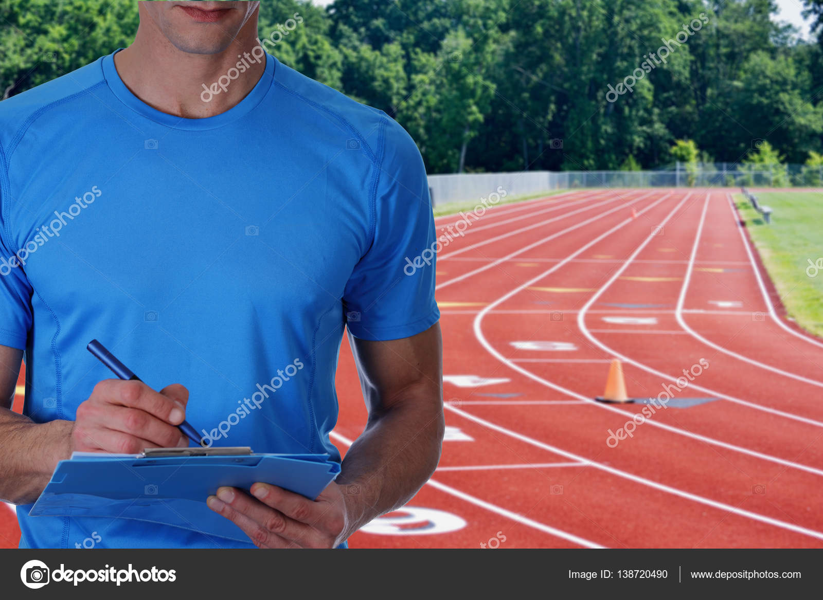Athletic trainer with workout plan close up on tracks. Sport, fitness