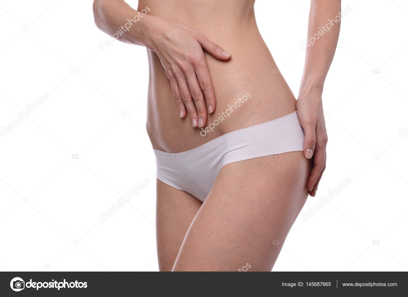 Slim body shape. Beautiful wearing white underwear isolated. Healthy body, torso, slim waist, belly, abdomen close up. Sport, fitness, results. Stock Photo by 145687665