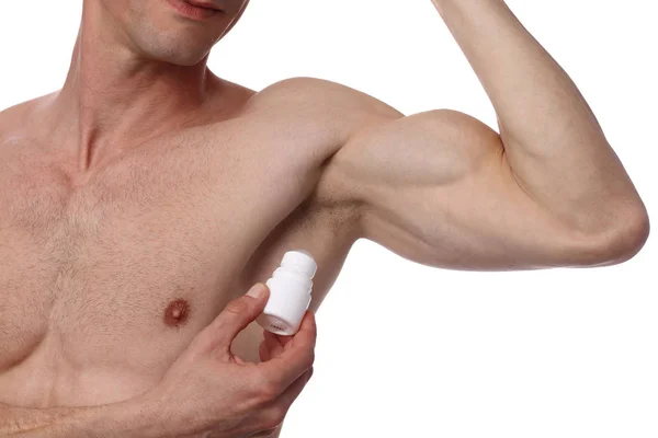 Uomo che applica il deodorante sull'ascella. Maschio mettendo bastone antitraspirante sulle ascelle — Foto Stock