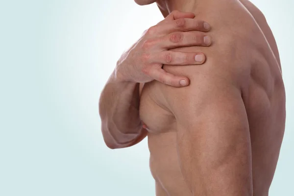 Sport injury, Man with shoulder pain. Pain relief and health care concept.
