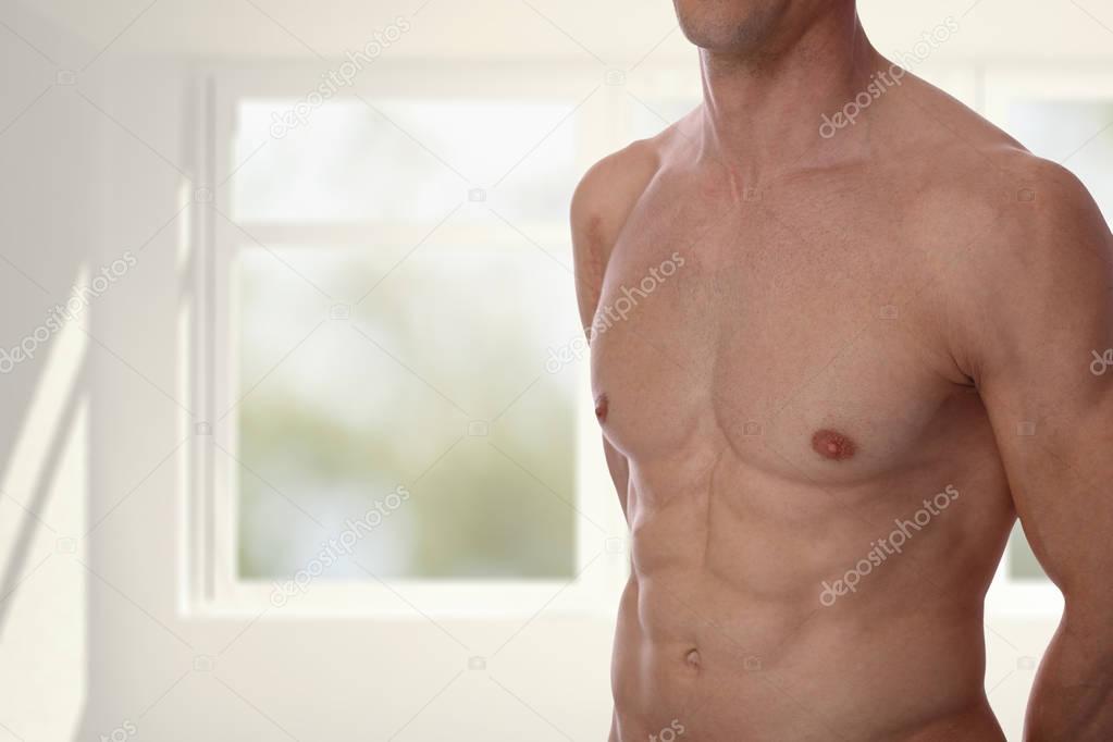 Close up of muscular male torso, chest and armpit hair removal. 