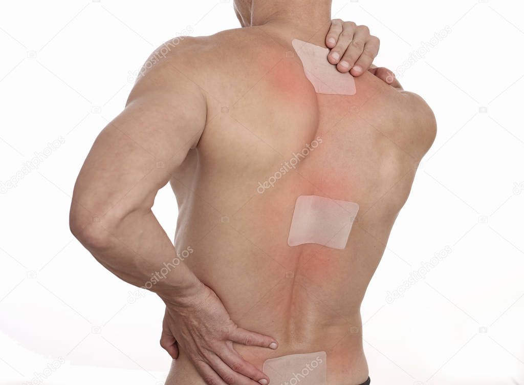 Medicated pain relief patch, plaster. man with back pain. Pain relief and health care concept isolated on white.