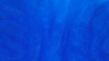 4 k görüntüleri. Suda mürekkep. Mavi mürekkep arka plan oluşturma suya tepki.