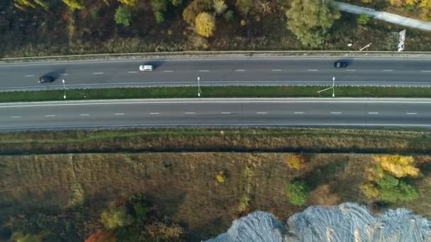Aerial drone footage. Fly over autobahn near forest top view shot. — Stock Video