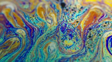 Renkli soyut arkaplan sıvısı gökkuşağı renkleri hareket halinde, makro çekim