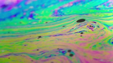 Renkli soyut arkaplan sıvısı gökkuşağı renkleri hareket halinde, makro çekim