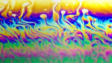 Renkli soyut arkaplan sıvısı gökkuşağı renkleri hareket halinde, makro çekim