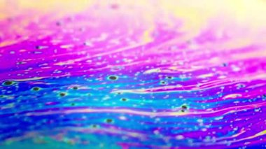 Renkli soyut arkaplan sıvısı gökkuşağı renkleri hareket halinde, makro çekim