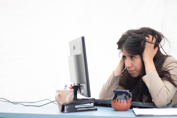  Totally overwhelmed office employee front of her computer screen