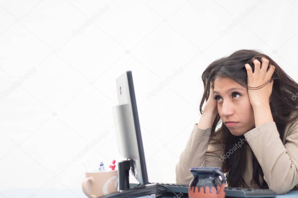 Mexico city, Mexico, May 1st 2017, Totally overwhelmed office employee front of her computer screen
