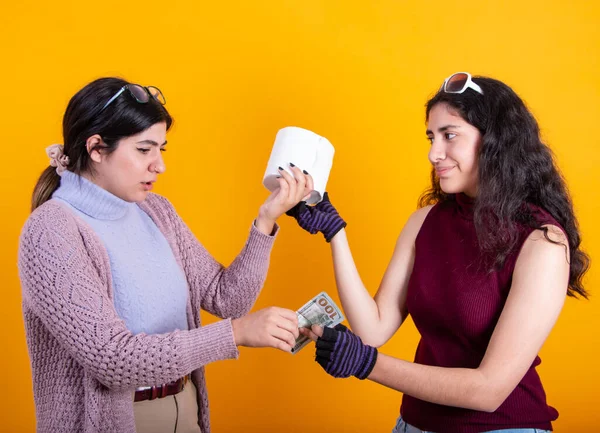 stock image Women fighting for TP (toilet paper) amidst Coronavirus (Covid-19) pandemic; panic buying as epidemic spreads across the globe