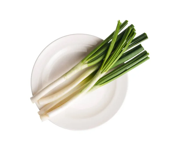 Plate with spring onions on white background — Stock Photo, Image