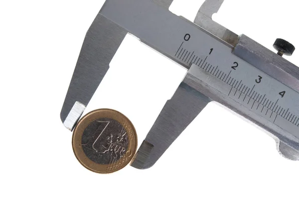 Vernier caliper with a coin Stock Picture