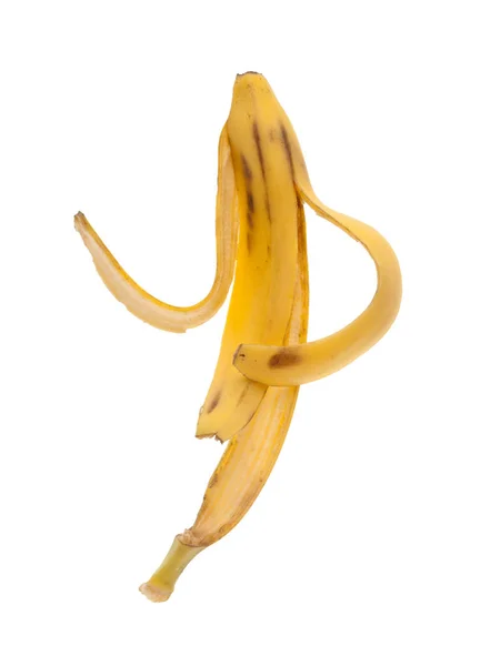 Pele de banana escorregadia em um fundo branco — Fotografia de Stock