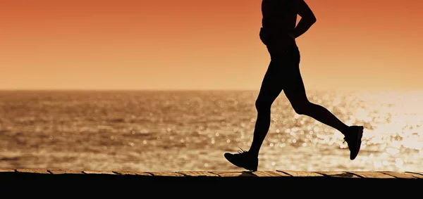 Silhouette of sport active man running — Stock Photo, Image