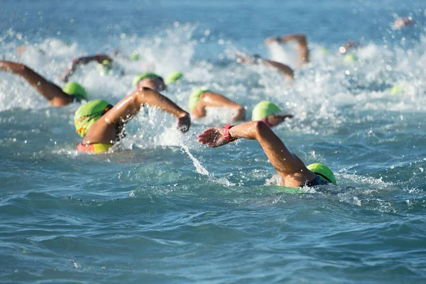 Group people in wetsuit swimming — Stock Photo, Image