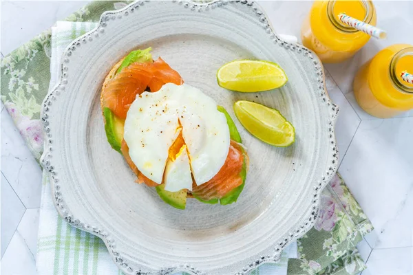 Poached egg, salmon and avocado open sandwich