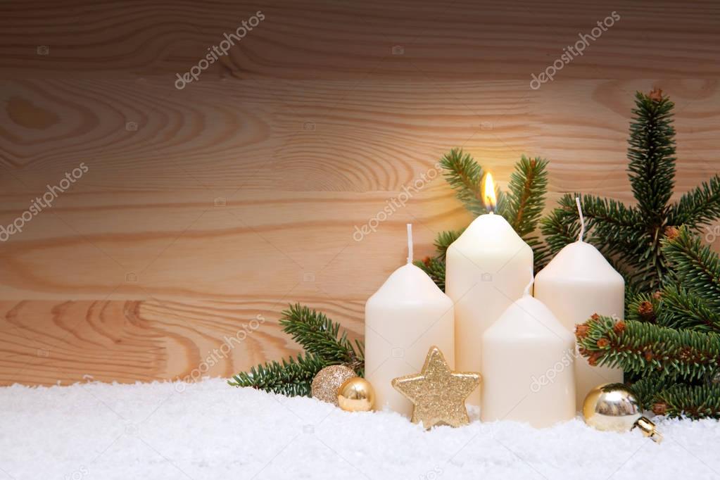 White burning candle for the first advent.