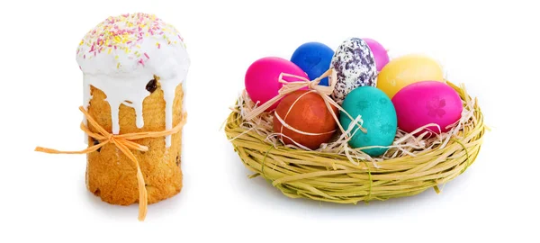 Easter eggs in the wicker basket and cake . — Stock Photo, Image