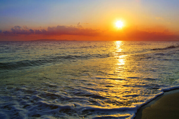 Beautiful sunrise on the Greek beach.
