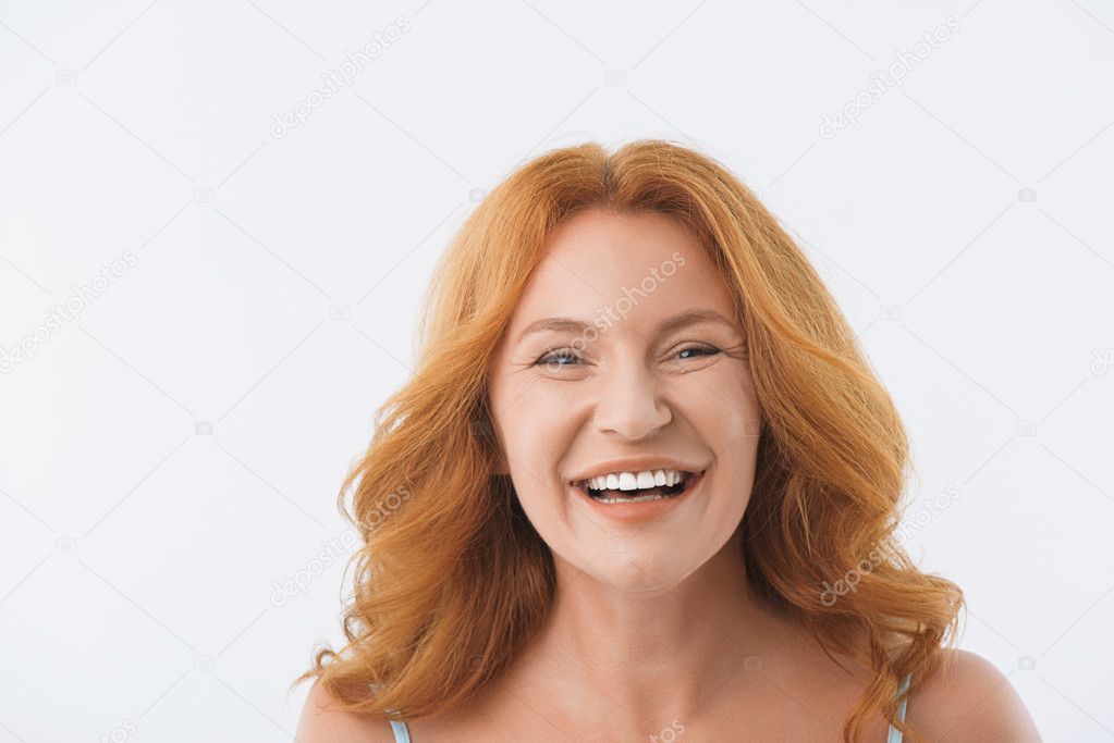 Middle-aged lady smiling with happiness
