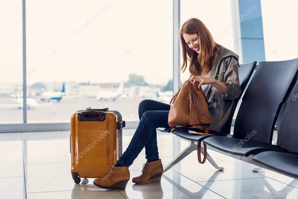 Smiling girl waiting for boarding