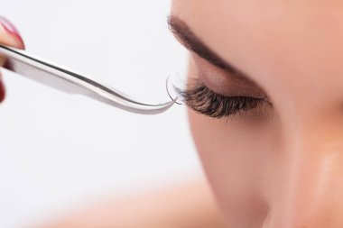Artificial eyelash growth procedure in details clipart