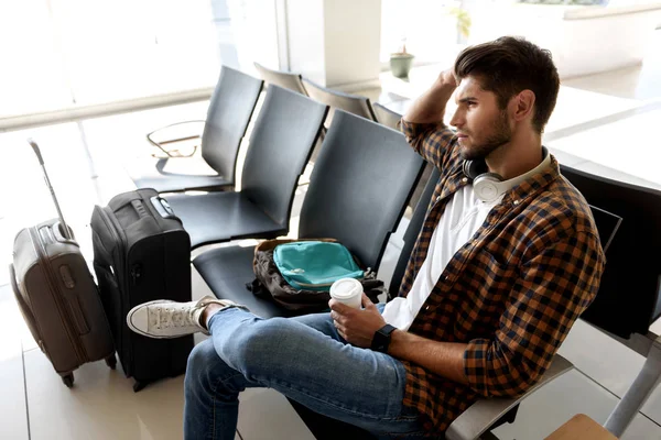 Thoughtful guy preparing for travel — Stock Photo, Image