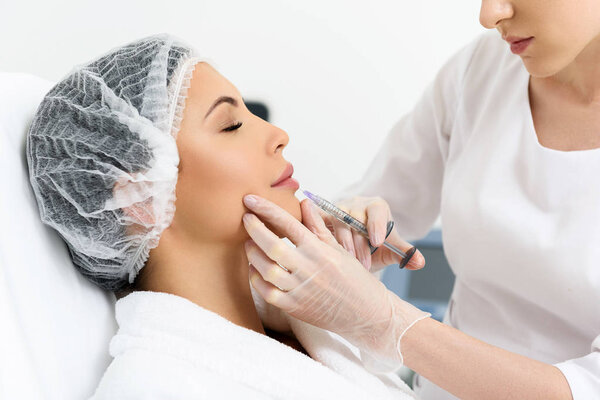 Pretty lady having hyaluronic treatment