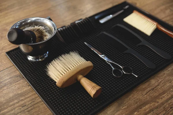 Tools of hair stylist on wooden table — Stock Photo, Image