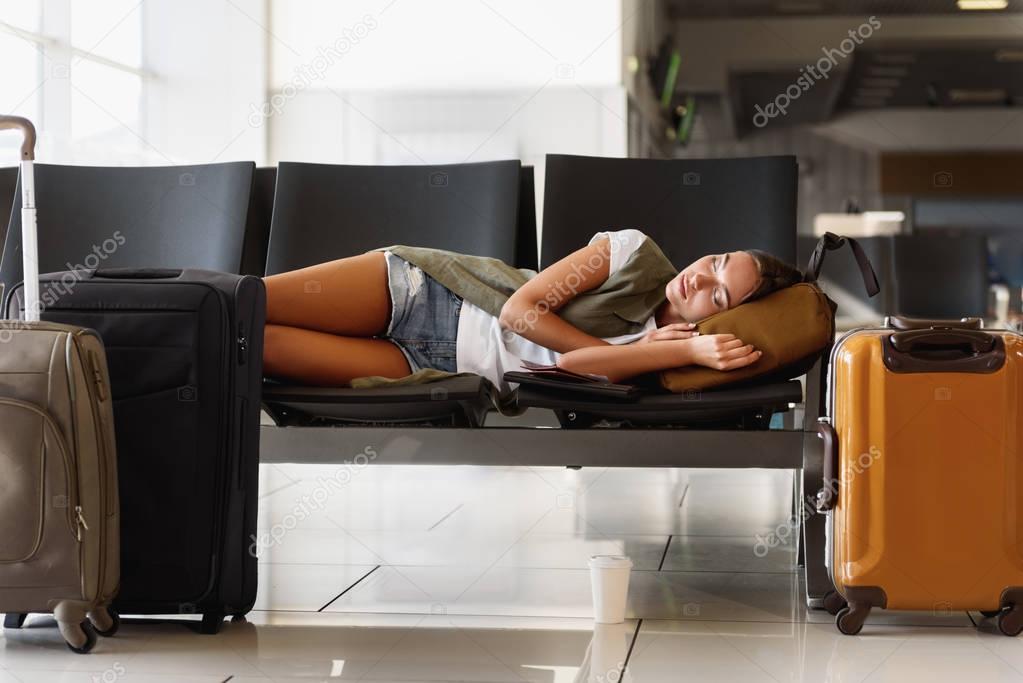 Pretty woman sleeping in airport