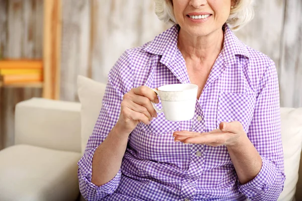 Mature lady enjoying hot drink — Stock Photo, Image