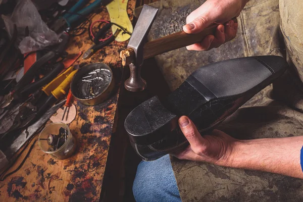 Shoe sole repairing with tools — Stock Photo, Image