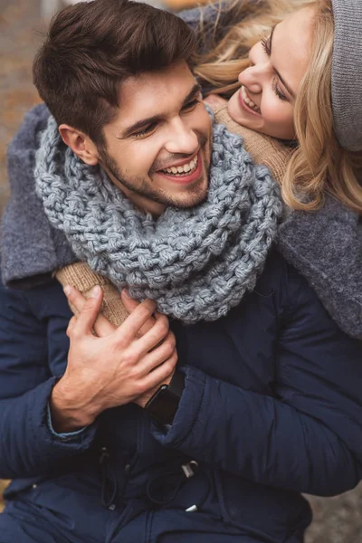 Joyful woman embracing man with love — Stock Photo, Image