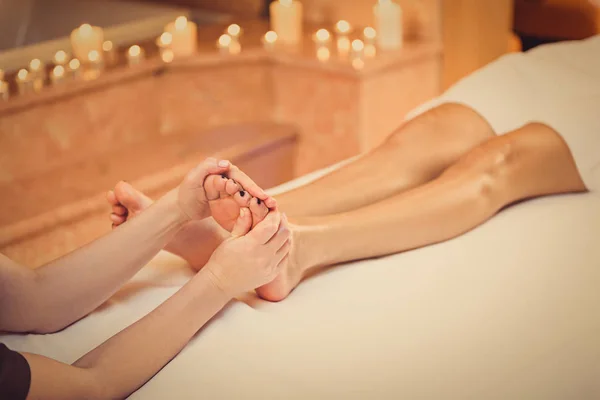 Young woman enjoying foot treatment