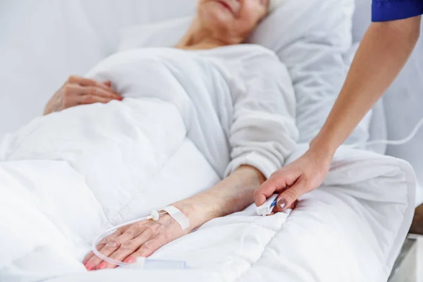 Female retiree is on drop of glass — Stock Photo, Image