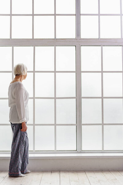 Dreamed retiree looking on the street in clinic