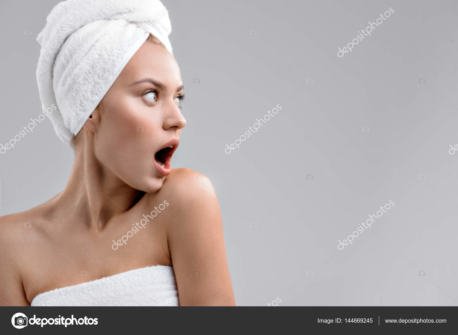 Shocked young woman after shower Stock Photo by ©iakovenko123 144669245