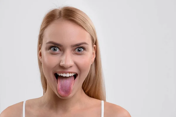 Mischievous young woman expressing her emotions — Stock Photo, Image