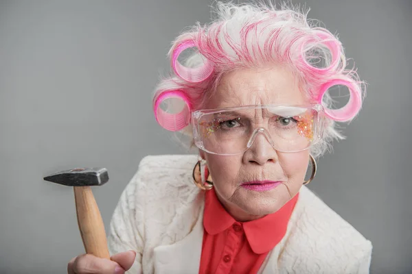 Senior woman in safety glasses posing — Stock Photo, Image