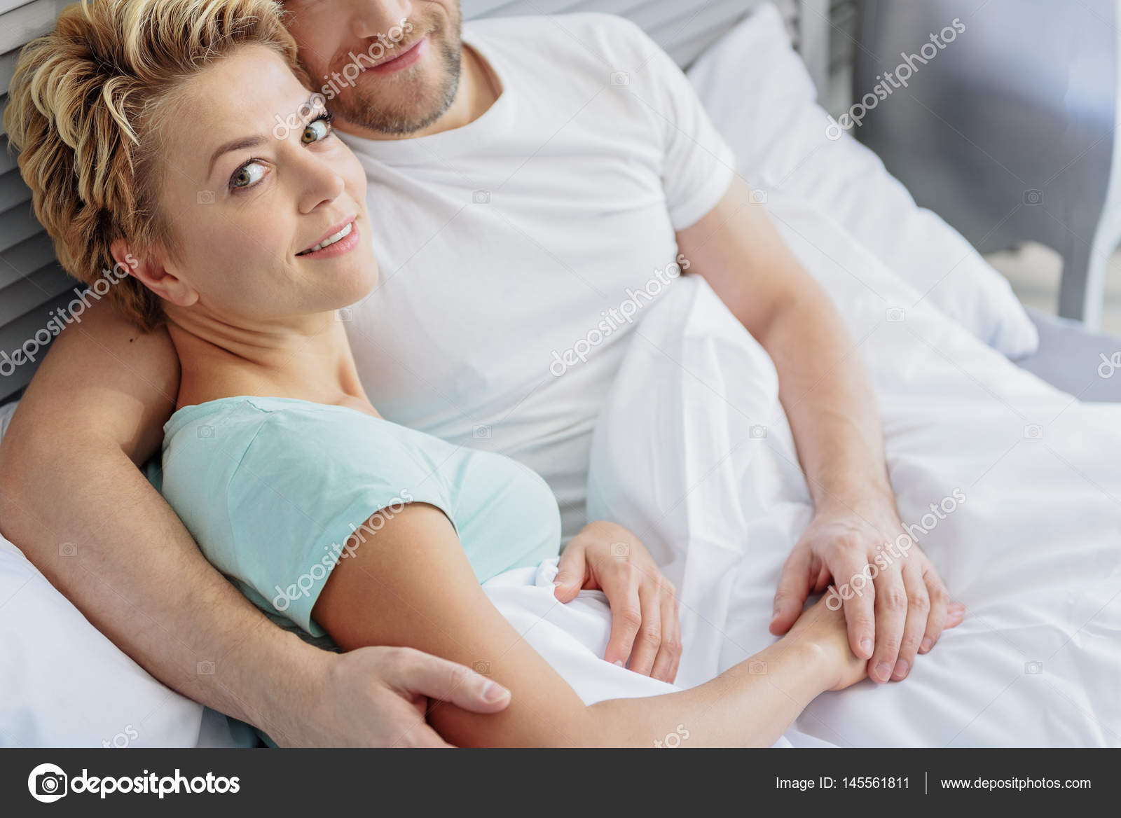 Cute Married Couple Hugging In Bedroom Stock Photo